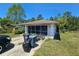 Screened-in garage offering extra storage space and a driveway at 15920 Sw 49Th Court Rd, Ocala, FL 34473