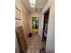 Hallway features tile flooring and access to other rooms, providing a clear view throughout the home at 15920 Sw 49Th Court Rd, Ocala, FL 34473