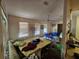 Open-concept living room with natural light from large windows at 15920 Sw 49Th Court Rd, Ocala, FL 34473