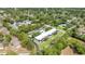 Aerial view of apartment homes surrounded by lush trees at 1640 Ne 40Th Ave # 107, Ocala, FL 34470