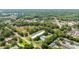 Aerial view showing apartment homes, pool, carports and neighborhood surroundings at 1640 Ne 40Th Ave # 107, Ocala, FL 34470