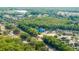Aerial view showcasing the neighborhood's lush tree coverage near commercial area at 1640 Ne 40Th Ave # 107, Ocala, FL 34470