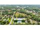 A high aerial view captures apartment homes and nearby commercial areas at 1640 Ne 40Th Ave # 107, Ocala, FL 34470
