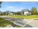 Exterior view of the charming condo building with well-maintained landscaping and manicured bushes at 1640 Ne 40Th Ave # 107, Ocala, FL 34470