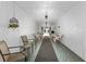 Exterior hallway with textured walls, tiled flooring, and comfortable seating at 1640 Ne 40Th Ave # 107, Ocala, FL 34470