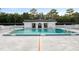 Community swimming pool featuring depth markings and an adjacent clubhouse at 1640 Ne 40Th Ave # 107, Ocala, FL 34470