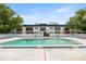 Condo exterior with a view of the community pool, showcasing outdoor living at 1640 Ne 40Th Ave # 107, Ocala, FL 34470