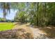 Scenic walking path beside lush greenery, perfect for a relaxing stroll outdoors at 1640 Ne 40Th Ave # 107, Ocala, FL 34470