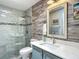 Beautiful bathroom with modern vanity, walk-in shower, and elegant gray tile at 16954 Se 93Rd Cuthbert Cir, The Villages, FL 32162