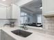 Kitchen sink and countertop, looking out at an adjacent dining area and sitting room at 16954 Se 93Rd Cuthbert Cir, The Villages, FL 32162