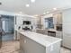 Spacious kitchen with a center island, stainless steel appliances, and abundant counter space at 16954 Se 93Rd Cuthbert Cir, The Villages, FL 32162