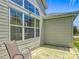 Outdoor patio with chair and siding at 16954 Se 93Rd Cuthbert Cir, The Villages, FL 32162