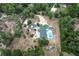 Aerial view of a sprawling estate featuring a main house, guest house, and pool at 170 Sw 80Th St, Ocala, FL 34476