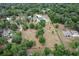 Aerial view of the sprawling acreage with mature trees surrounding the estate at 170 Sw 80Th St, Ocala, FL 34476