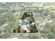 Estate aerial showcasing the home's layout, pool, and expansive grounds, offering privacy and space at 170 Sw 80Th St, Ocala, FL 34476