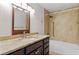 Traditional bathroom with granite counters, tiled shower, and modern fixtures at 170 Sw 80Th St, Ocala, FL 34476