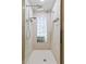 Elegant bathroom featuring a frameless shower with three shower heads and a decorative glass block window at 170 Sw 80Th St, Ocala, FL 34476