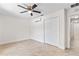 Clean bedroom with tile floors, a mini-split AC, and a closet adds to the functionality of the space at 170 Sw 80Th St, Ocala, FL 34476