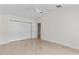 Comfortable bedroom featuring tile floors, a ceiling fan, and a closet at 170 Sw 80Th St, Ocala, FL 34476