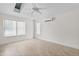 Neutral bedroom featuring tiled flooring, mini split AC and ample natural light, making it a comfortable retreat at 170 Sw 80Th St, Ocala, FL 34476