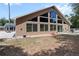 A home's exterior features many windows, as well as a spacious lawn at 170 Sw 80Th St, Ocala, FL 34476