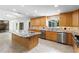 Spacious kitchen with stainless steel appliances, granite countertops, and ample cabinet space for cooking at 170 Sw 80Th St, Ocala, FL 34476