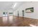 Bright living room features hardwood floors, vaulted ceiling, and a television at 170 Sw 80Th St, Ocala, FL 34476
