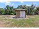 Exterior image of a small, secure shed in a well-kept yard at 170 Sw 80Th St, Ocala, FL 34476