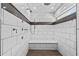 Modern shower with elegant tile work, multiple shower heads, and a built-in seat for ultimate relaxation at 170 Sw 80Th St, Ocala, FL 34476