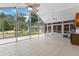 Bright sun room featuring large windows offering picturesque outdoor views at 170 Sw 80Th St, Ocala, FL 34476