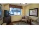 Bedroom with a nice view and a comfortable chair at 20820 River Dr # B32, Dunnellon, FL 34431