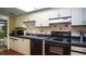 Well-maintained kitchen featuring laminate countertops and black appliances at 20820 River Dr # B32, Dunnellon, FL 34431
