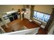 Open floor plan with hardwood floors and a balcony view at 20820 River Dr # B32, Dunnellon, FL 34431
