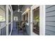 Screened in porch with outdoor seating and decor at 20820 River Dr # B32, Dunnellon, FL 34431