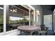 Inviting porch area with seating, outdoor lighting, and sliding glass doors to interior space at 20820 River Dr # B32, Dunnellon, FL 34431
