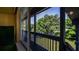 Screened in porch with view of backyard at 20820 River Dr # B32, Dunnellon, FL 34431
