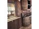 Rustic bar area with barrel accents, vintage charm and a pass-through window at 2151 Se 177Th Ave, Silver Springs, FL 34488