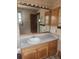 Functional bathroom with a large mirror, vanity and cabinet at 2151 Se 177Th Ave, Silver Springs, FL 34488