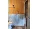 Bathroom features a unique wood and metal wall design and glass-enclosed shower at 2151 Se 177Th Ave, Silver Springs, FL 34488