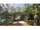 Exterior view of metal carport next to a garage at 2151 Se 177Th Ave, Silver Springs, FL 34488