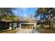 Charming single-story home features a screened-in garage and well-maintained front yard at 2151 Se 177Th Ave, Silver Springs, FL 34488
