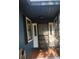 Covered front porch with brick flooring, white trim, and a classic front door at 2151 Se 177Th Ave, Silver Springs, FL 34488
