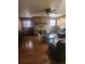 Spacious living room features a brick fireplace, hardwood floors, and ample seating at 2151 Se 177Th Ave, Silver Springs, FL 34488