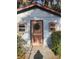 Exterior view of the shed featuring an ornate sunburst pattern on the door at 2151 Se 177Th Ave, Silver Springs, FL 34488