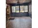 Relaxing sunroom featuring wood walls and flooring, with windows allowing natural light to filter in at 2151 Se 177Th Ave, Silver Springs, FL 34488