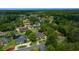 An aerial view of a neighborhood showcases mature trees and well-maintained homes at 2272 Se Laurel Run Dr, Ocala, FL 34471