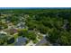 This aerial highlights a home nestled within a lush, green neighborhood at 2272 Se Laurel Run Dr, Ocala, FL 34471