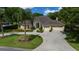Aerial view of a home boasting a circular driveway and a three-car garage at 2272 Se Laurel Run Dr, Ocala, FL 34471