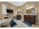 Bathroom with freestanding tub, double vanities, TV, skylight, and tile floors at 2272 Se Laurel Run Dr, Ocala, FL 34471