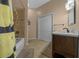 Full bathroom with shower and tub, as well as a vanity with dark cabinets at 2272 Se Laurel Run Dr, Ocala, FL 34471